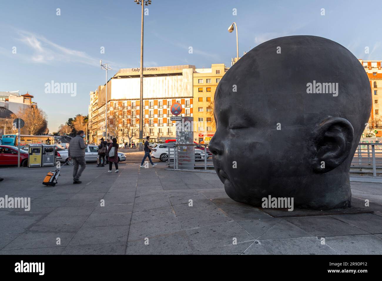 Madrid, SpainFEB 17, 2022 Bronze gigantic baby head sculptures by