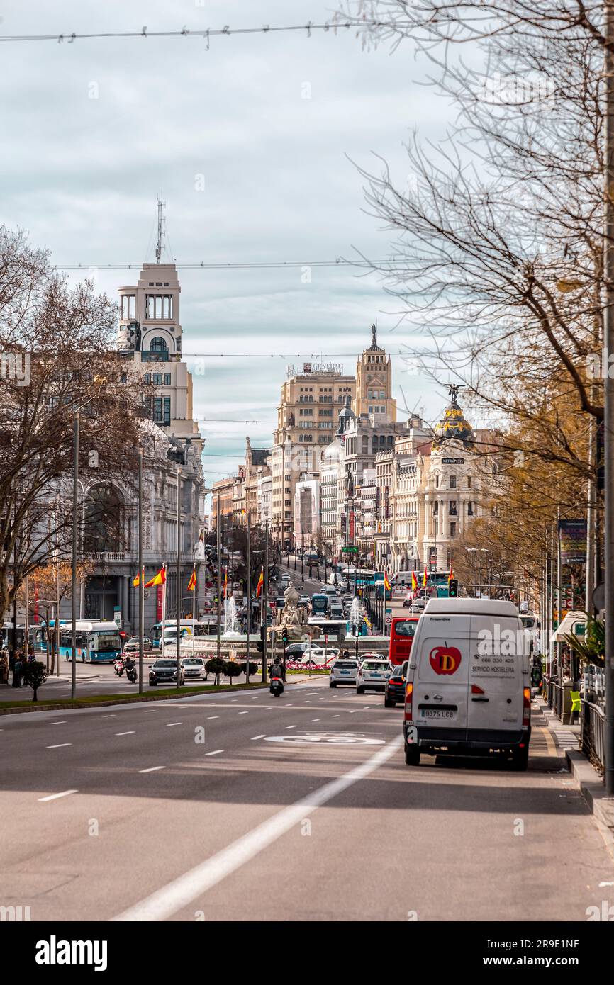 Madrid, Spain - FEB 16, 2022: Calle de Alcala, Madrid. Historical buildings, palaces, hotels and the cars in motion. Stock Photo