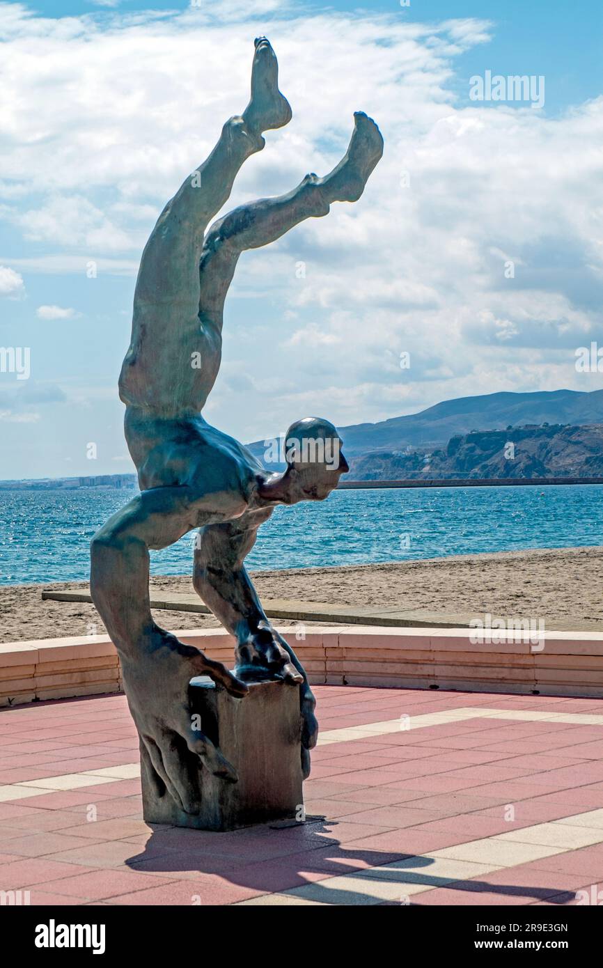 Statue of Balancing Man on Almeria Beach in Spain Stock Photo