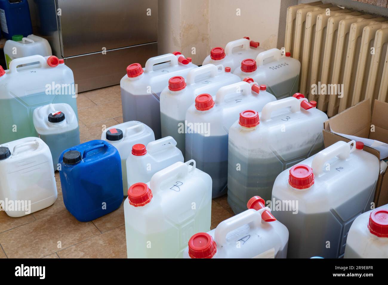 Toxic waste in jerry cans in the chemistry laboratory Stock Photo