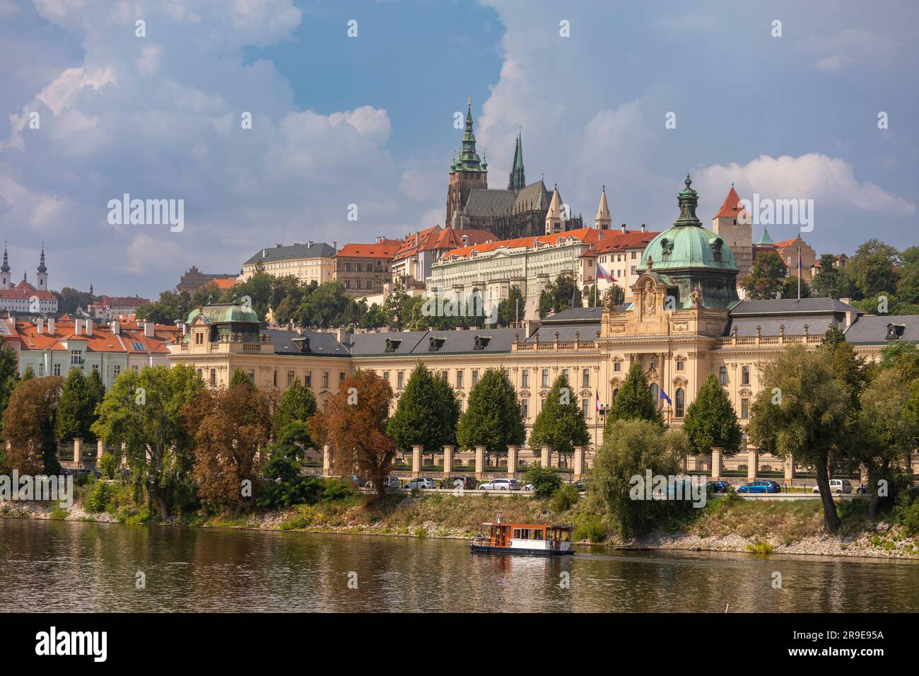 PRAGUE, CZECH REPUBLIC, EUROPE - Straka Academy building, the office of the Czech Republic Government, on the Vltava RIver. Above left is Prague Castl Stock Photo