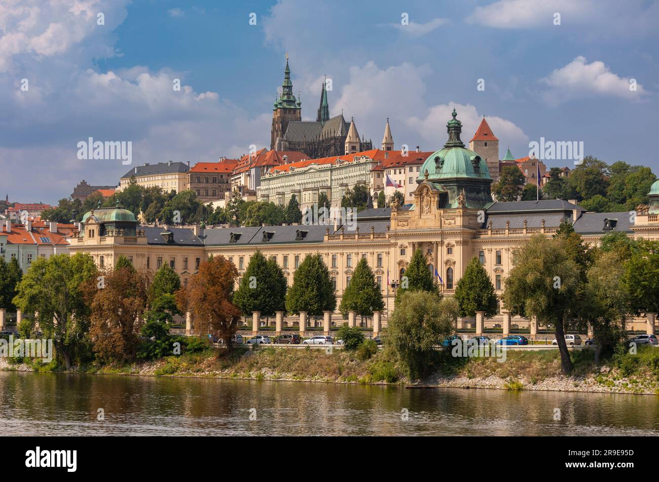 PRAGUE, CZECH REPUBLIC, EUROPE - Straka Academy building, the office of the Czech Republic Government, on the Vltava RIver. Above left is Prague Castl Stock Photo