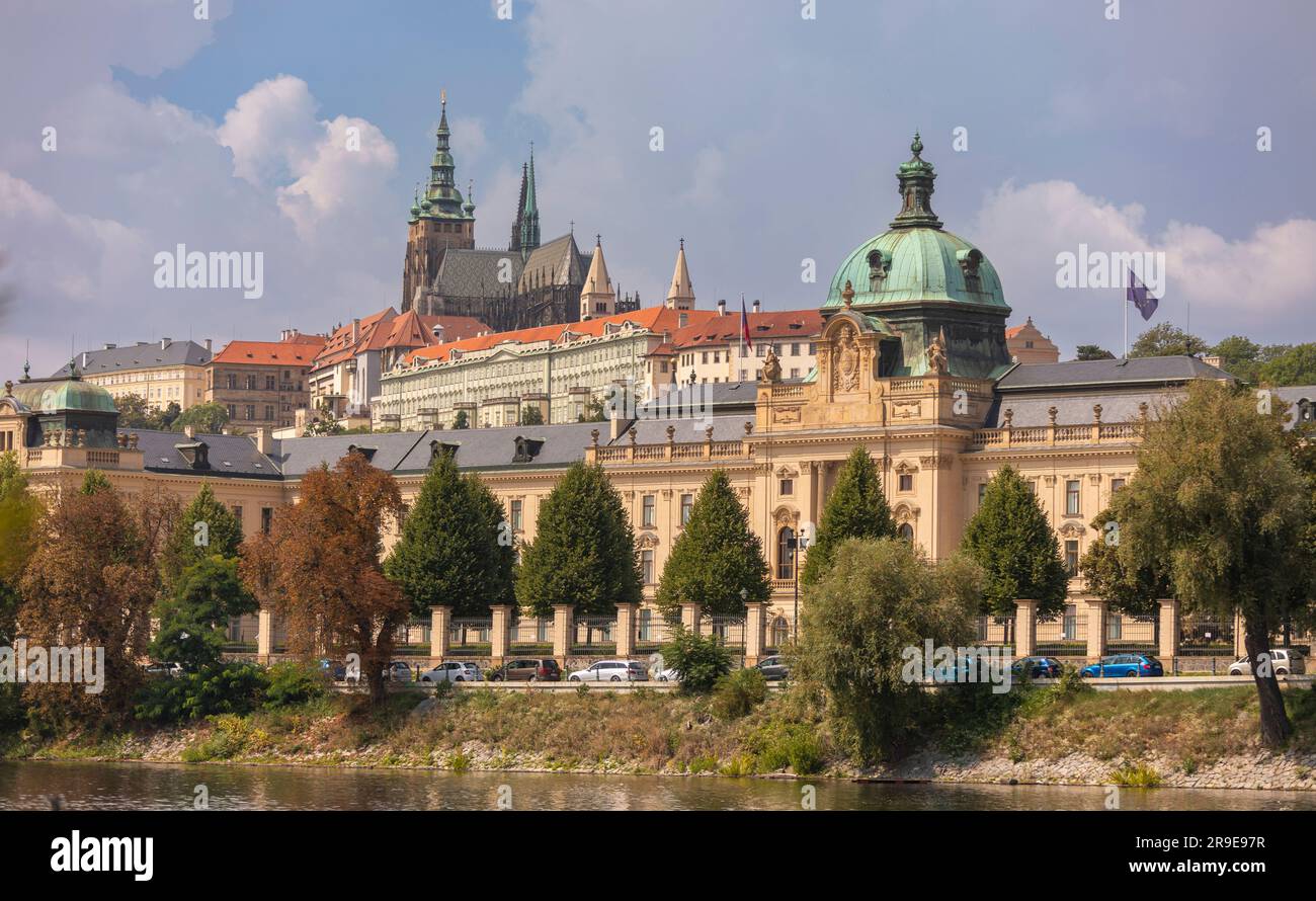 PRAGUE, CZECH REPUBLIC, EUROPE - Straka Academy building, the office of the Czech Republic Government, on the Vltava RIver. Above left is Prague Castl Stock Photo