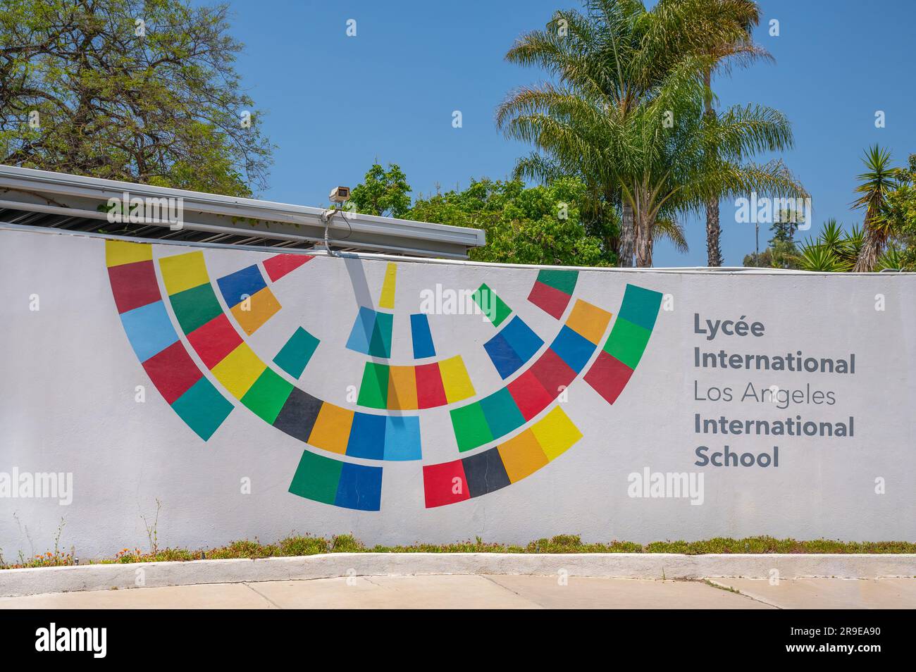 Los Angeles, CA, USA - May 20, 2023: Sign at entrance to French International School, Lycee International Los Angeles, colorful logo on white wall wit Stock Photo
