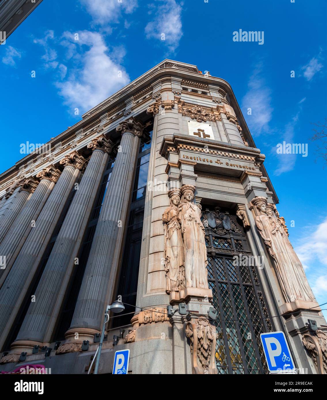 Madrid, Spain - FEB 19, 2022: Cityscape and architecture at the Calle de Alcala, Madrid. Facade view of the Cervantes Institution. Stock Photo