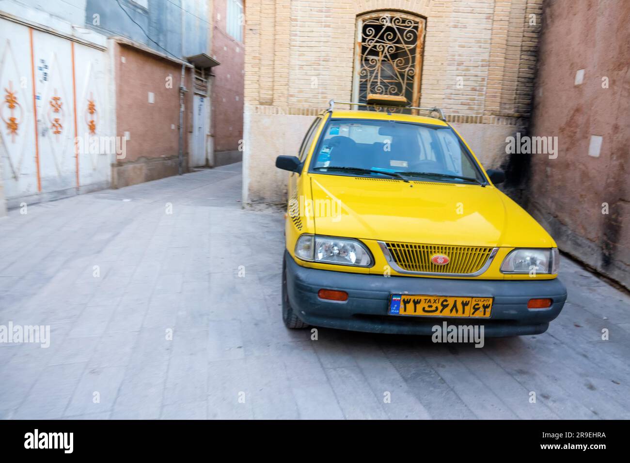 Shiraz, Iran December 31, 2022 An Iranianmade passenger car on a narrow street of the old
