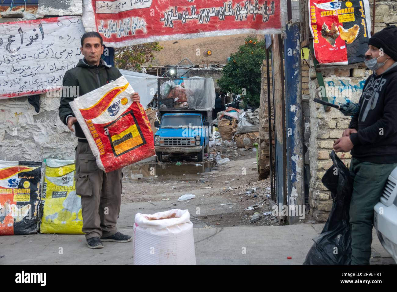 Overloaded with bags of waste, vehicle moves on higway, Shiraz, Iran. –  Stock Editorial Photo © grigvovan #167601202