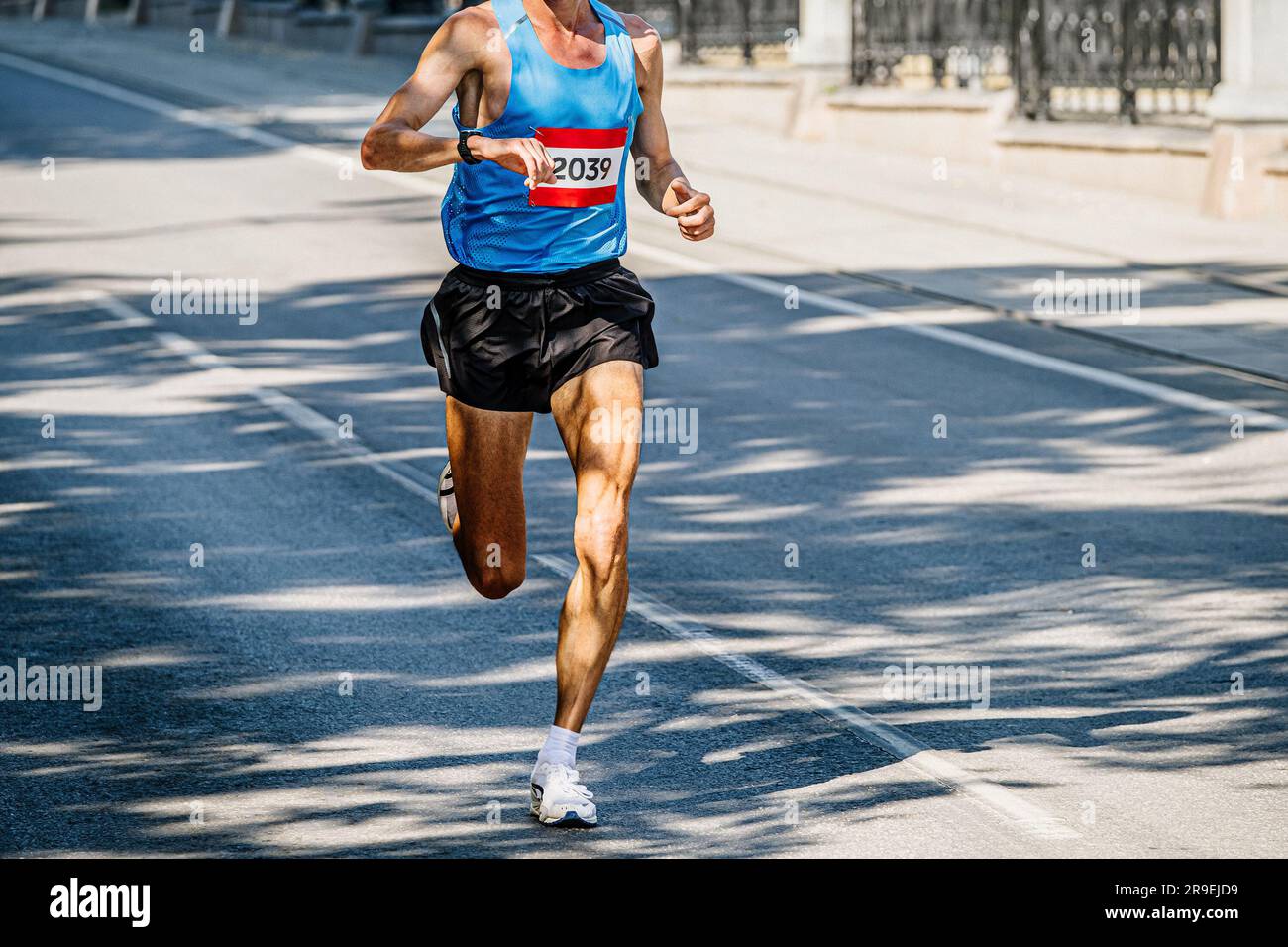 Measuring The Running Speed Of An Athlete Using A Mechanical Stopwatch Hand  With A Stopwatch On The Background Of The Legs Of A Runner Stock Photo -  Download Image Now - iStock