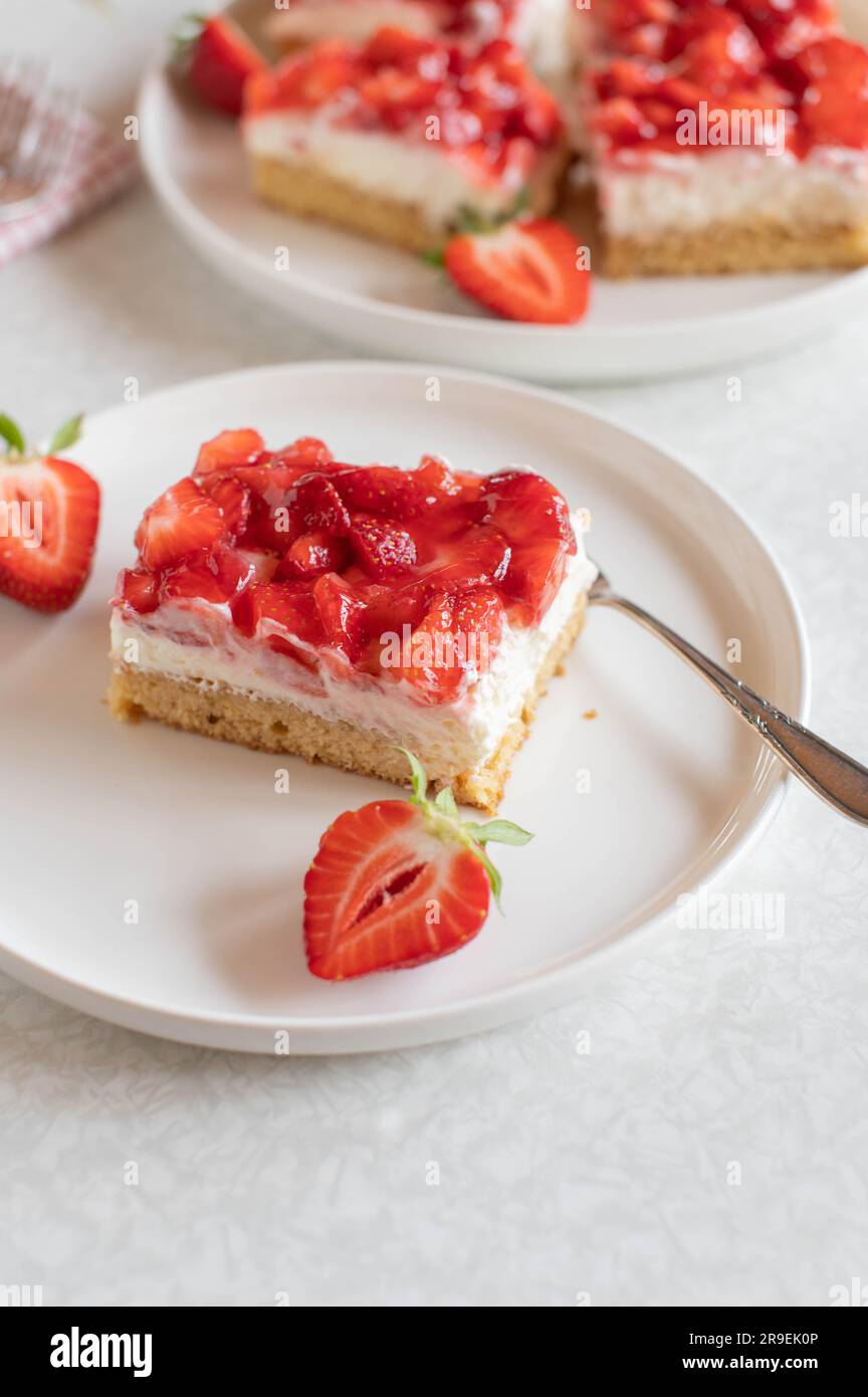 Slice of strawberry cream cake on a plate Stock Photo