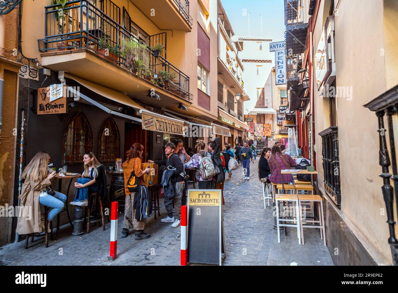 Granada, Spain - February 22, 2022: Generic architecture and street view with cafes and stores in the historical city of Granada in Andalusia, Spain. Stock Photo