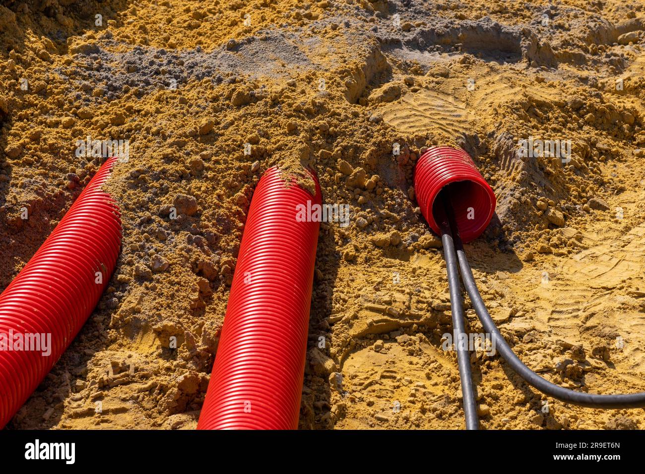 Red plumbing pipe closeup. Drainage, tubing, pipes. Red pipes of the