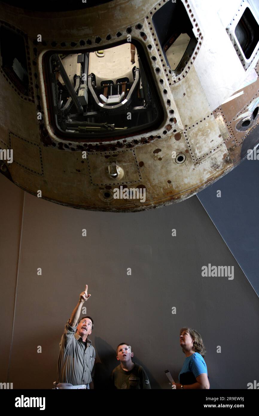 A family at the National Air and Space Museum, watching an Apollo ...