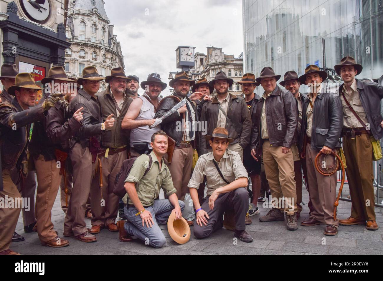London, UK. 26th June 2023. Indiana Jones fans dressed as their hero pose for a photo ahead of the premiere of Indiana Jones and the Dial of Destiny in Leicester Square. Stock Photo