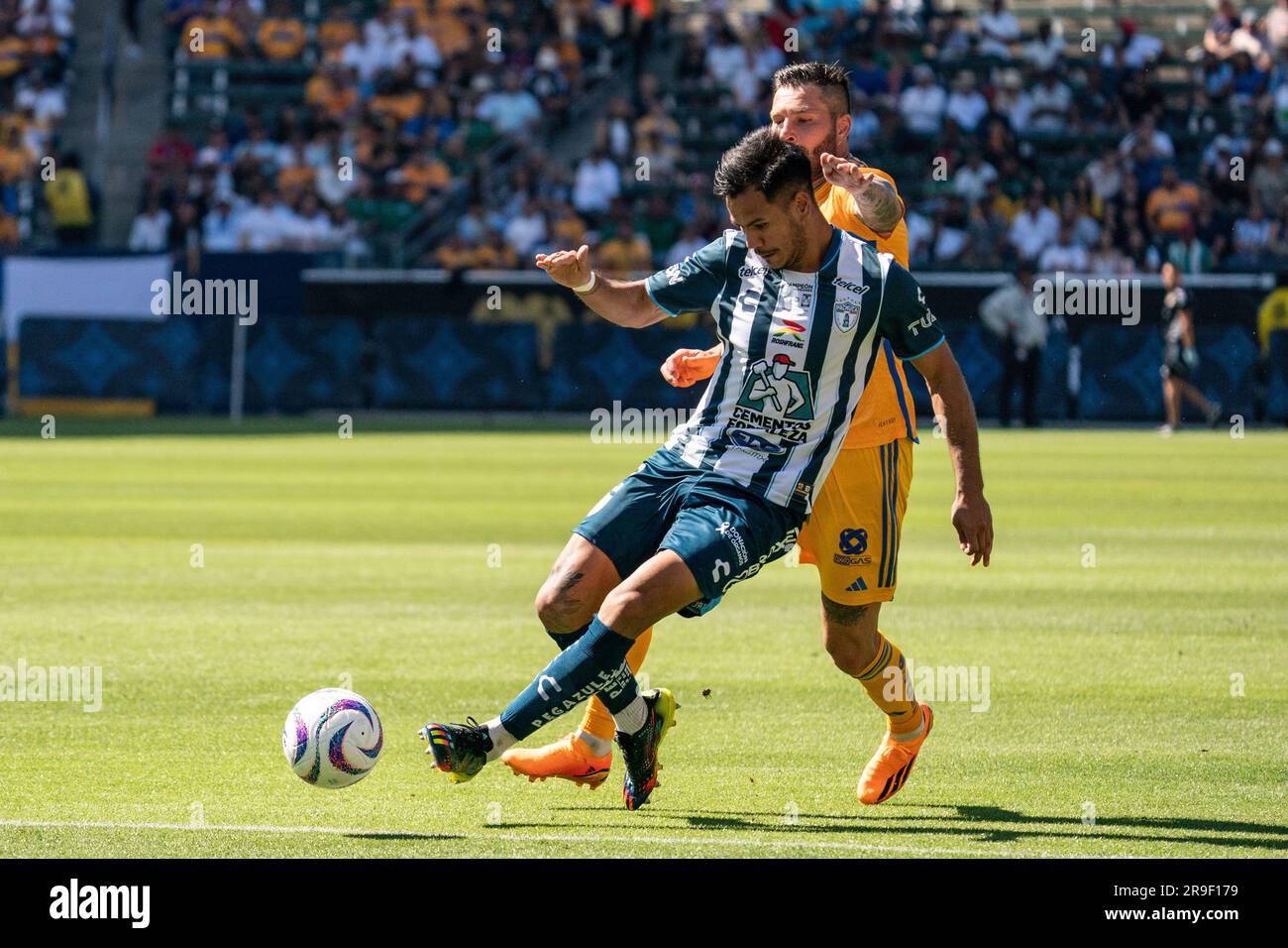 Pachuca defender Sergio Barreto (2) is fouled by UANL Tigres forward André-Pierre Gignac (10) during a Campeón de Campeones Liga MX match, Sunday, Jun Stock Photo