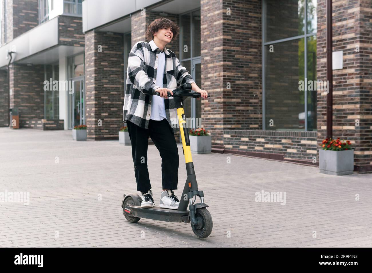 Male rides electric scooter hi-res stock photography and images - Alamy