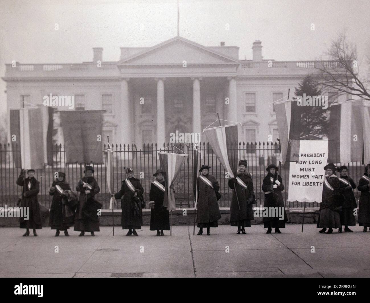 Picket picketing banner banners sign flags flag 1917 front hires stock
