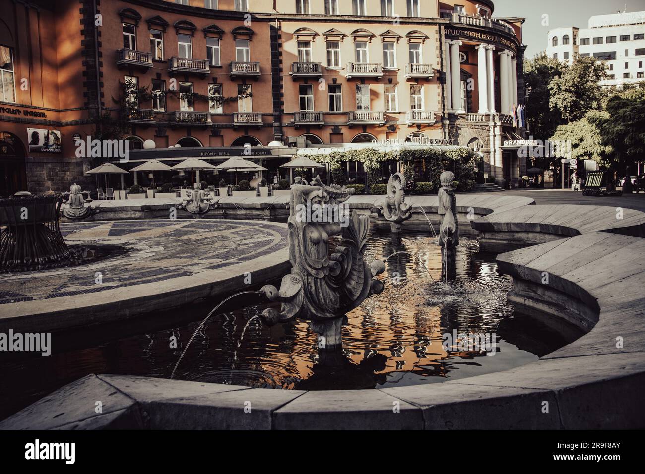 Old fountain with stone oriental statue of one of the streets of Yerevan. Stock Photo