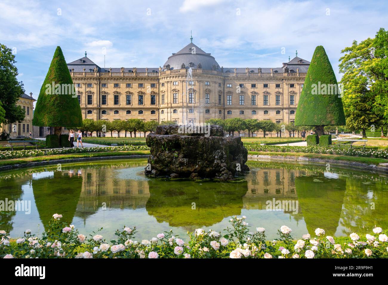 The Wurzburg Residence building and formal garden with flowers in Wurzburg, Germany Stock Photo