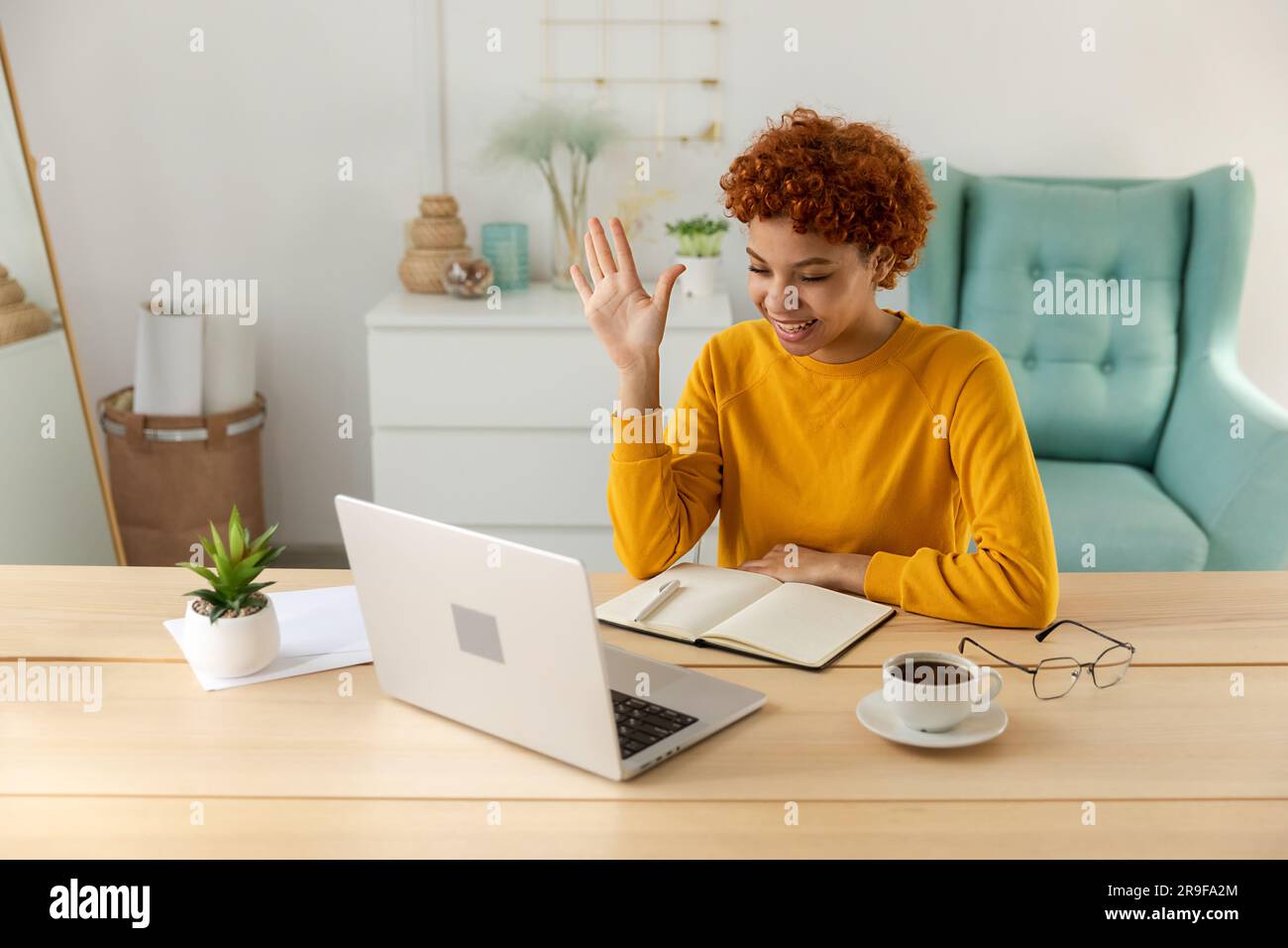 African american girl using laptop computer having video chat at home. Young  woman having virtual meeting online chat video call conference. Work  learning from home, remote teacher Stock Photo - Alamy