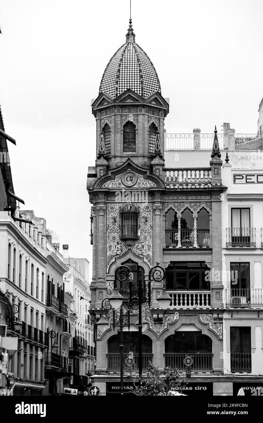 Seville, Spain-FEB 24, 2022: Typical street view and generic architecture in Seville, Andalusia, Spain. Stock Photo