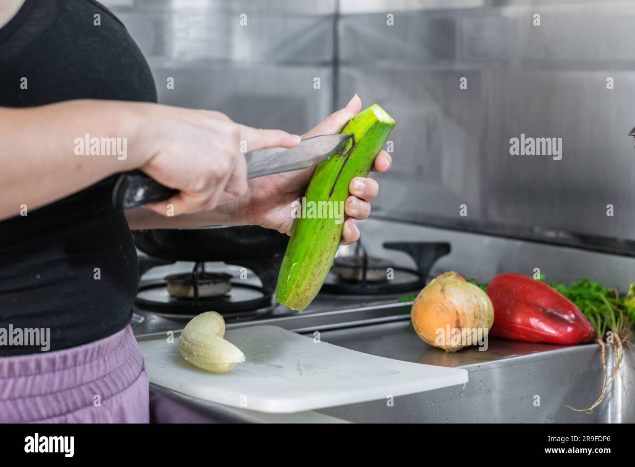 Woman peeling banana hi-res stock photography and images - Alamy