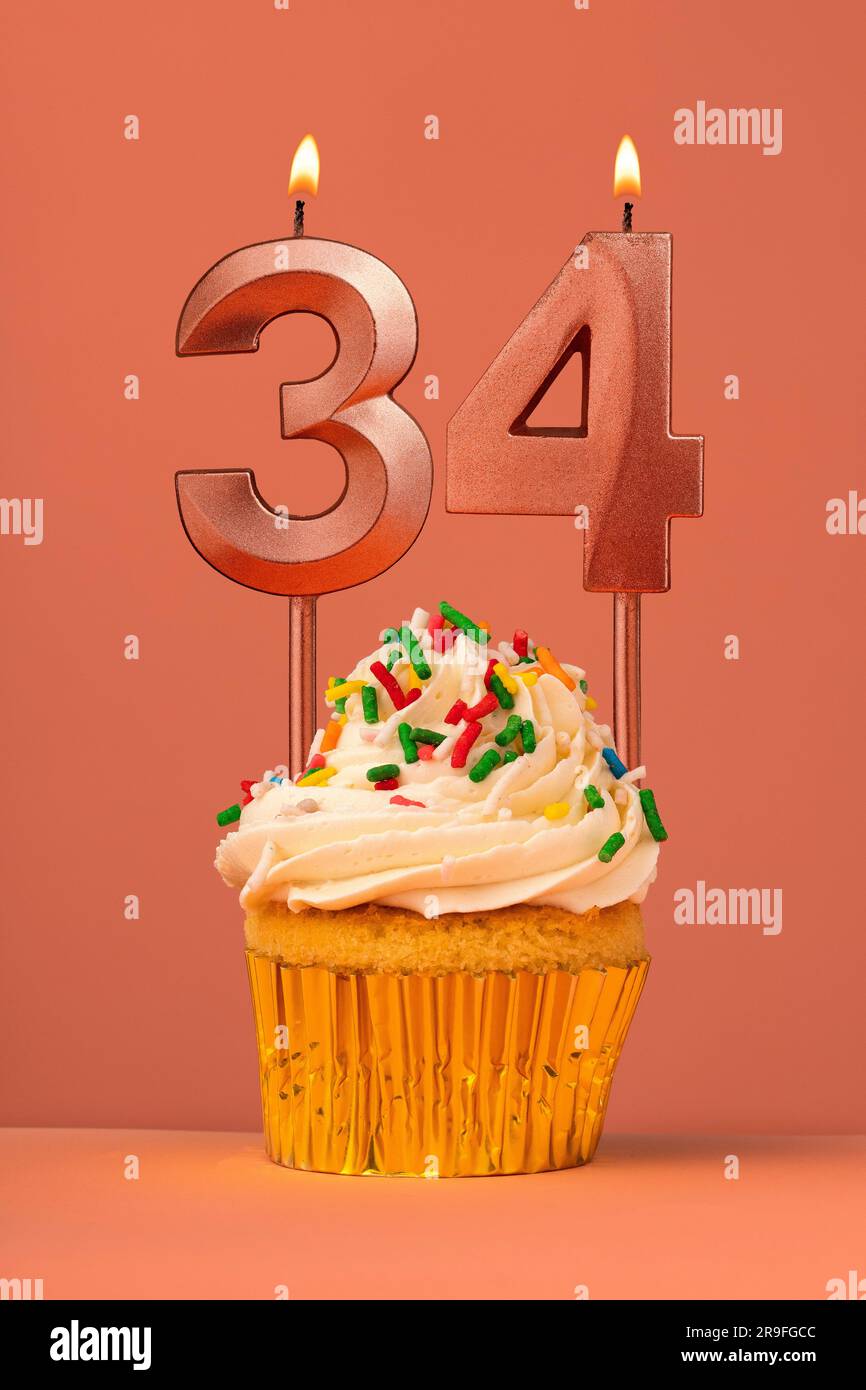 Candle number 34 - Cake birthday in coral fusion background Stock Photo ...