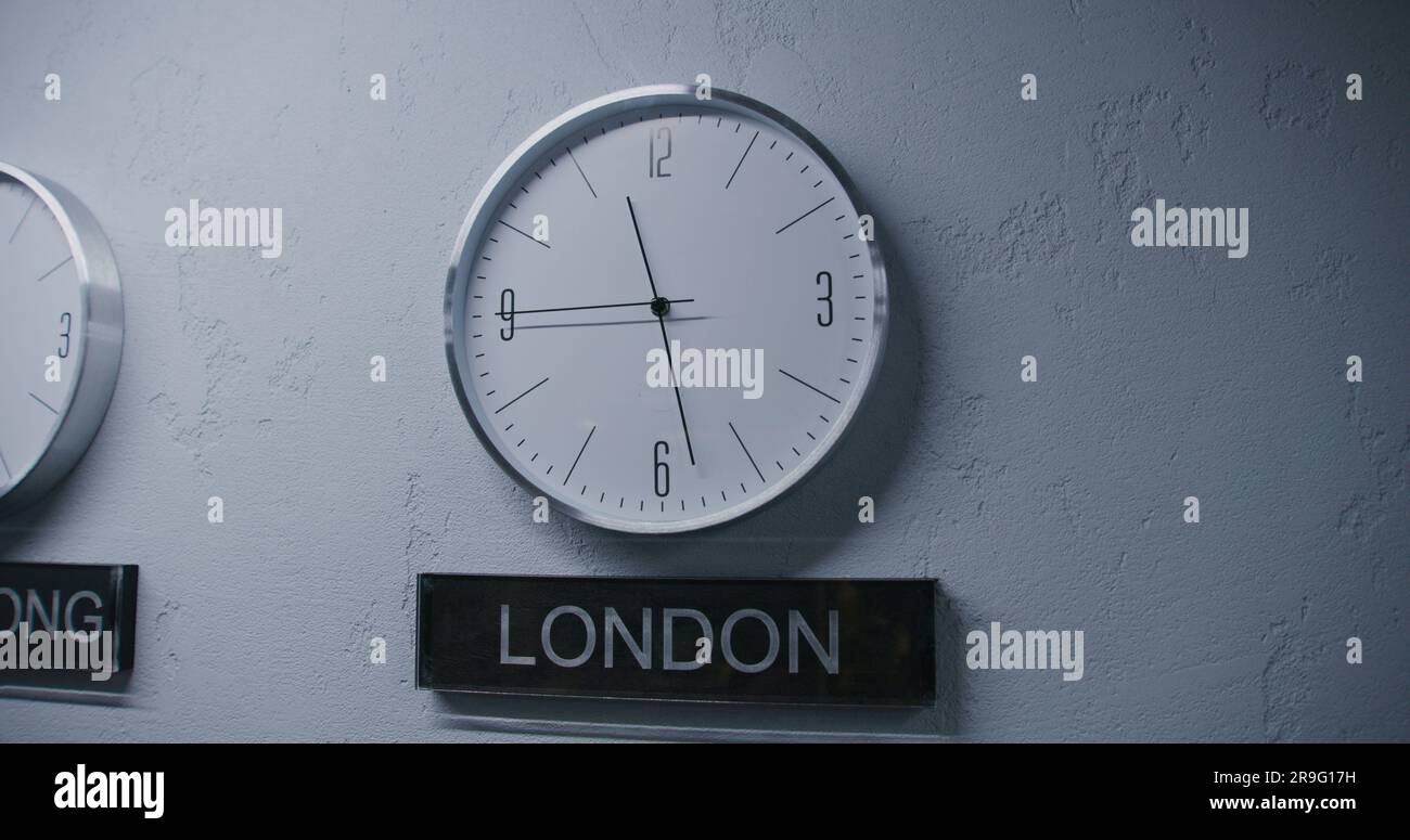 White watches with running time pointers show time zones of different