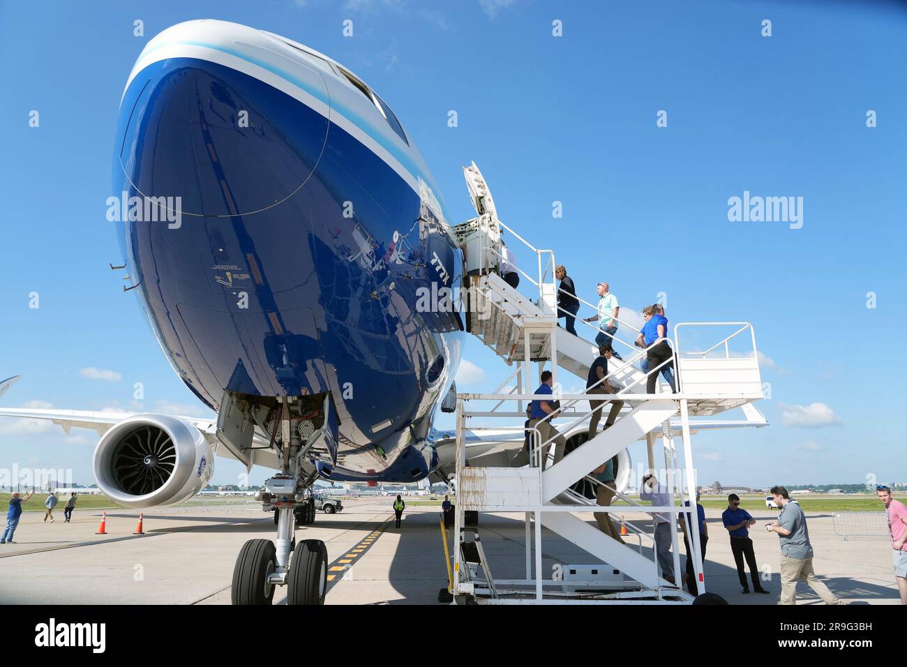 Boeing employees board a Boeing 777-9, commercial jet for a tour that is in St. Louis for a layover at St. Louis-Lambert International Airport in St. Louis on Monday, June 26, 2023. The 777-9 is the only Boeing commercial airplane with St. Louis- made parts on the aircraft. Boeing employees will spend the day touring the aircraft, seeing it for the first time since production began. Boeing employees in St. Louis produce the 777-9's folding wing tip, moveable trailing edge and fixed leading edge on the wings, as well as the rudder and elevator on the empennage. Photo by Bill Greenblatt/UPI Stock Photo