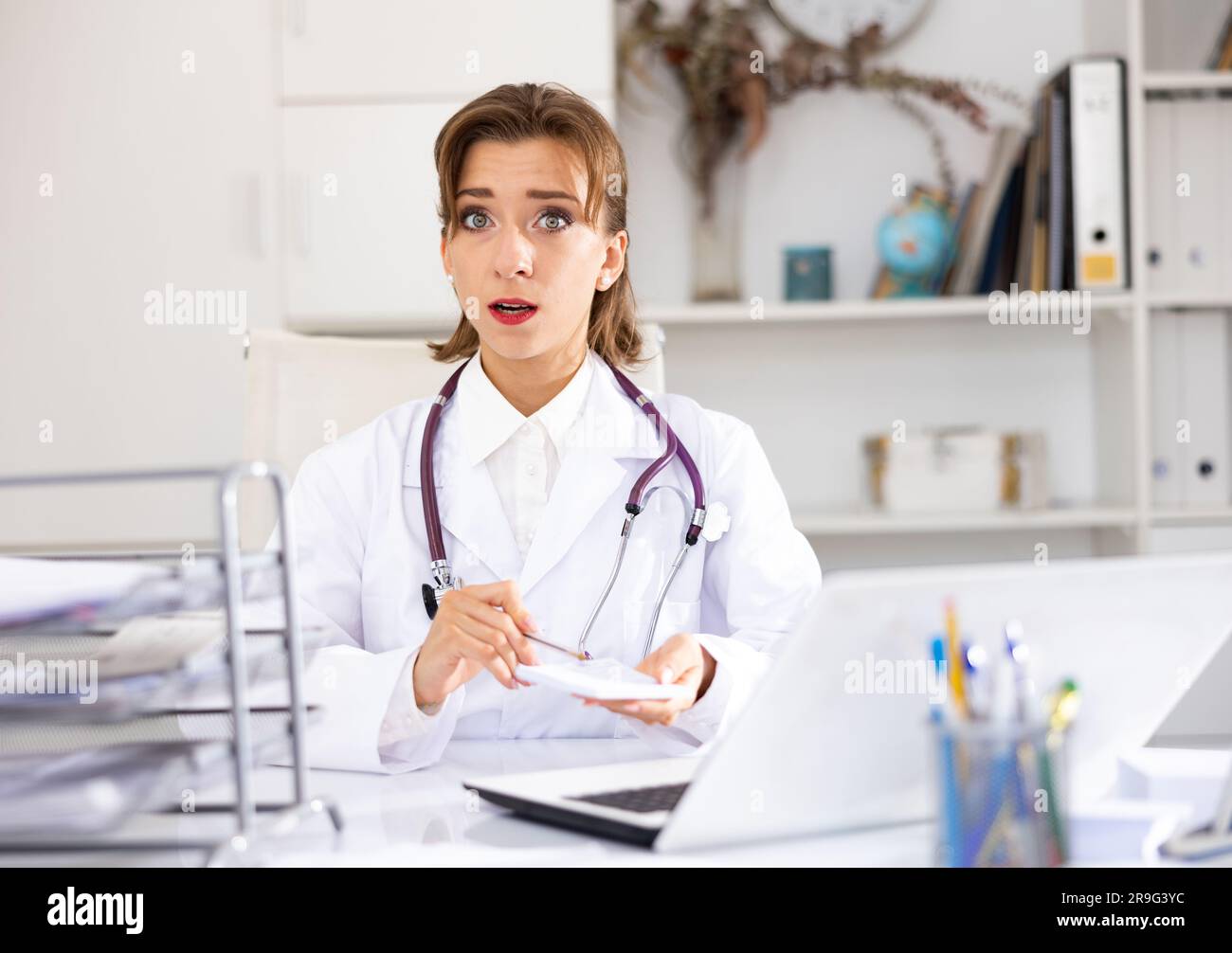 Portrait female doctor talking camera hi-res stock photography and ...