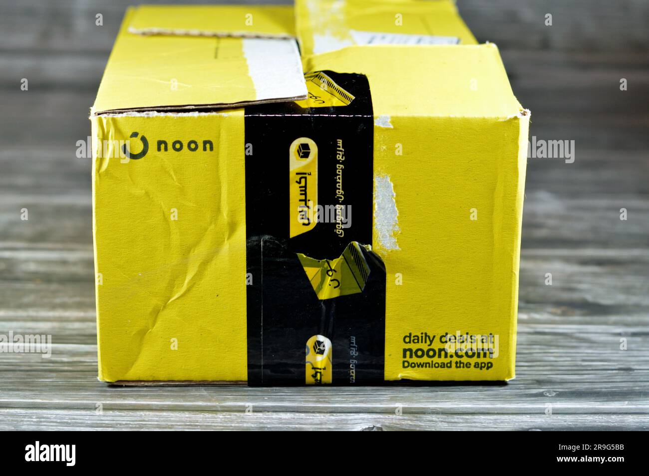 Cairo, Egypt, June 12 2023 Noon online shopping delivery yellow box