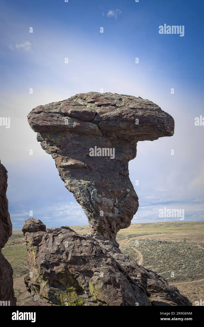 A photo of the famous landmark Balanced ROck against a partly cloudy