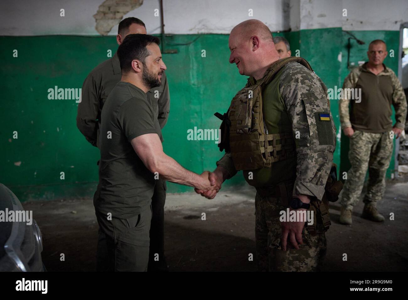 A day after an attemped military coup in Russia and during a working trip to Zaporizhzhia region, President Volodymyr Zelensky visited the frontline positions of the Armed Forces of Ukraine in the Melitopol sector.  At the command post, the Head of State listened to the report of Commander of the Tavria operational and strategic group of troops Brigadier General Oleksandr Tarnavskyi. The President was informed about the overall operational situation in the frontline area, the dynamics of advancement in the main directions and the need for certain types of weapons. Stock Photo