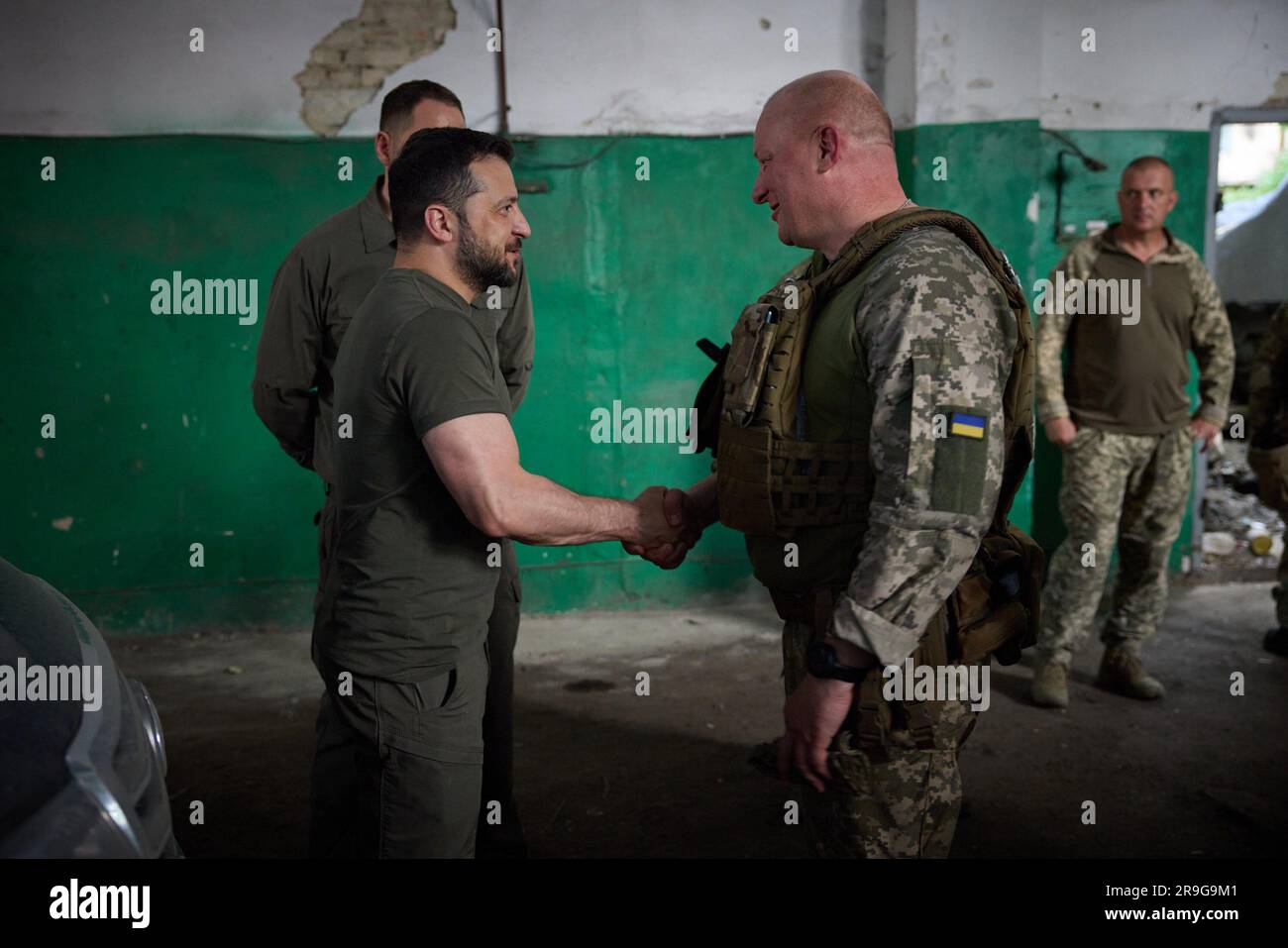 A day after an attemped military coup in Russia and during a working trip to Zaporizhzhia region, President Volodymyr Zelensky visited the frontline positions of the Armed Forces of Ukraine in the Melitopol sector.  At the command post, the Head of State listened to the report of Commander of the Tavria operational and strategic group of troops Brigadier General Oleksandr Tarnavskyi. The President was informed about the overall operational situation in the frontline area, the dynamics of advancement in the main directions and the need for certain types of weapons. Stock Photo