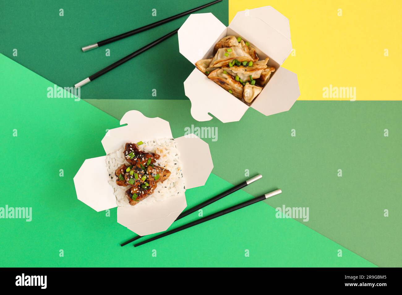 Boxes with tasty Chinese food and chopsticks on color background Stock  Photo - Alamy, image size:1300x956