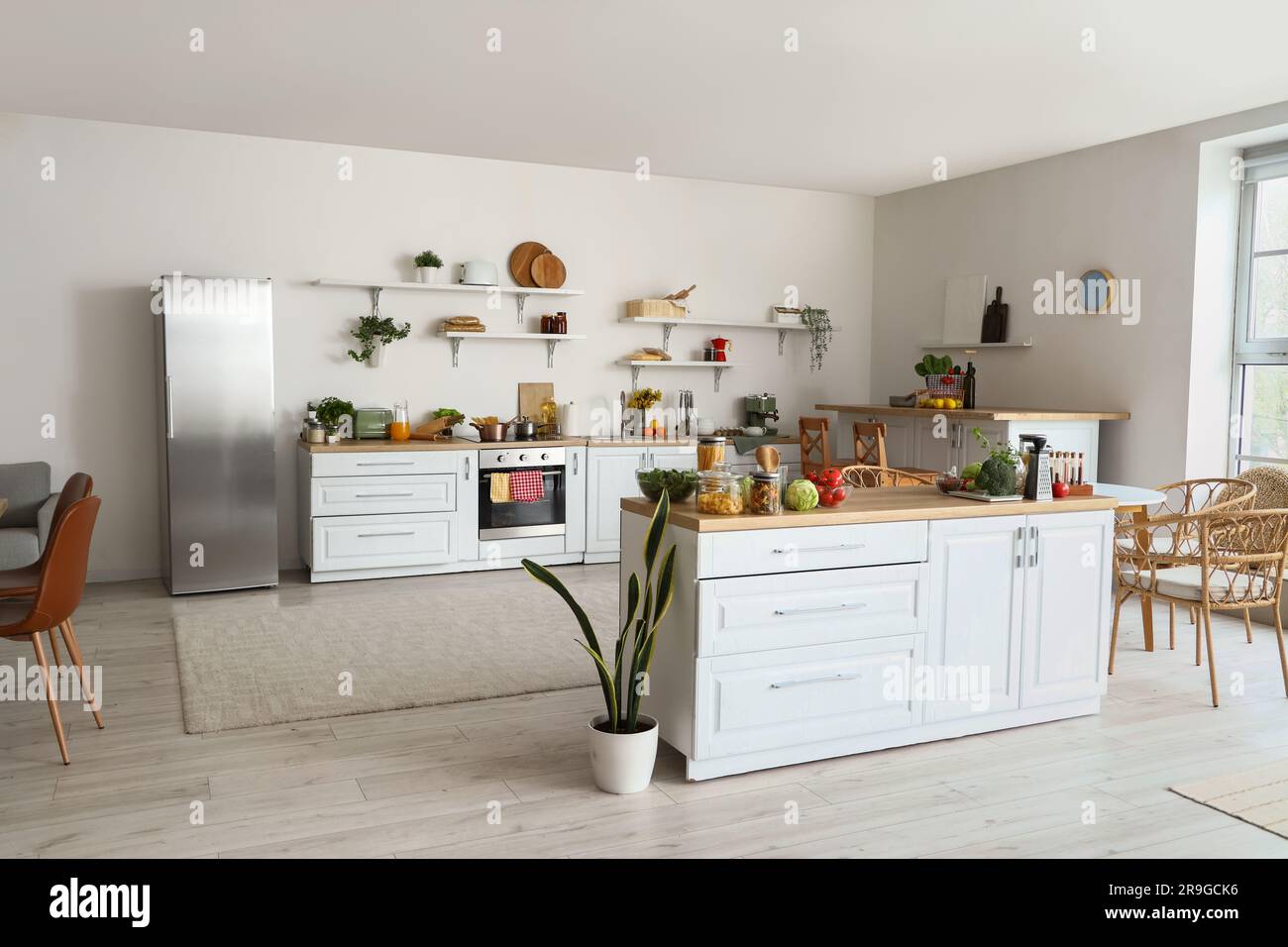 Interior of light kitchen with counters, shelves and food Stock Photo ...