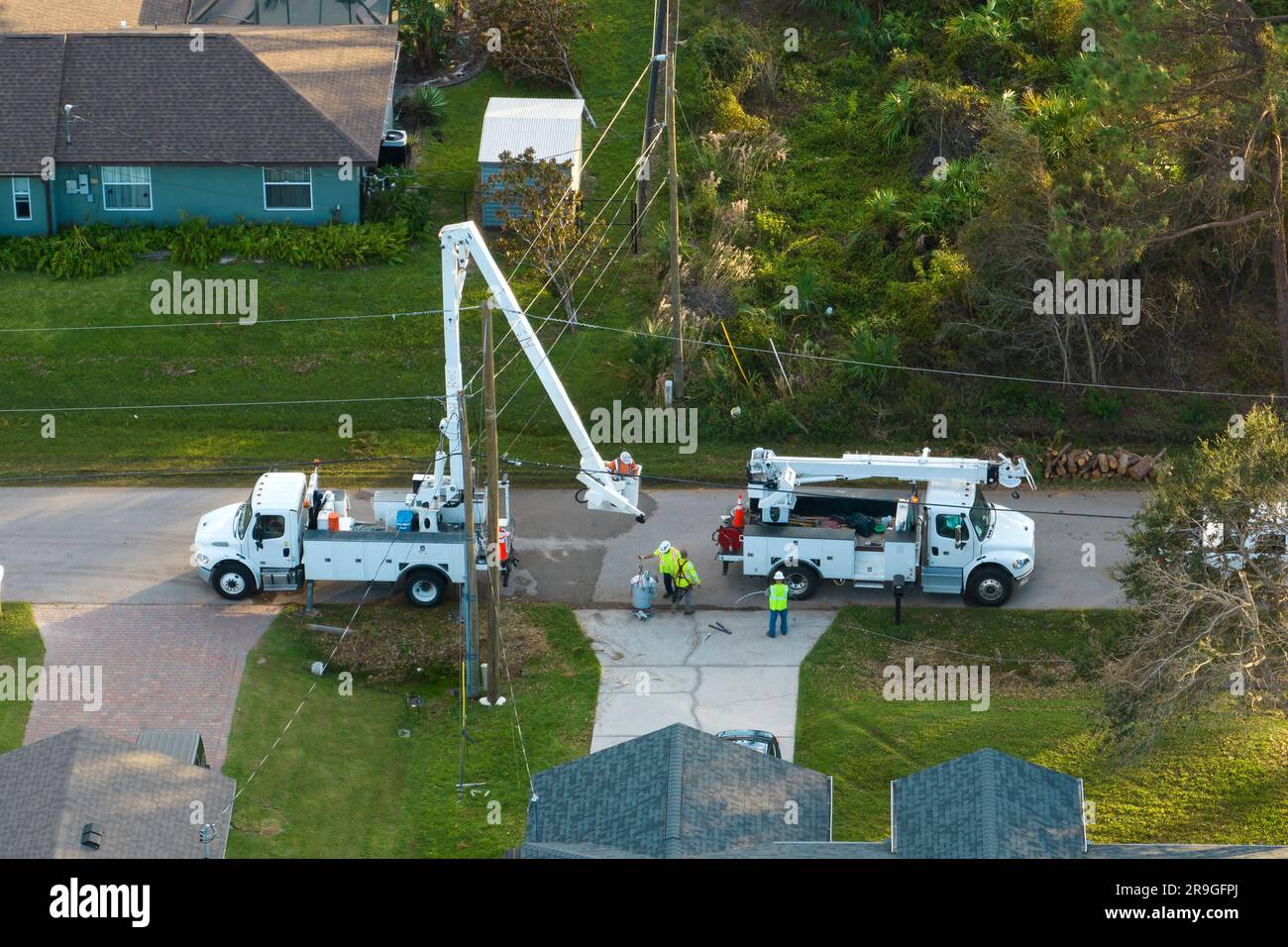 Electrical service company restoring power repairing damaged power