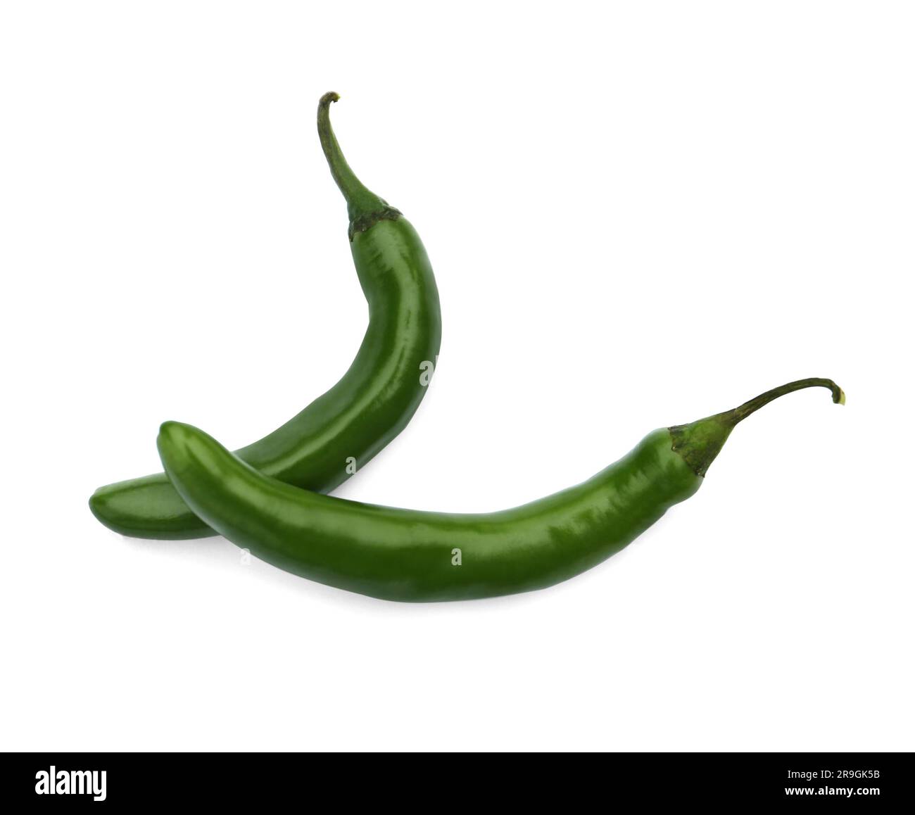 Green hot chili peppers on white background Stock Photo - Alamy
