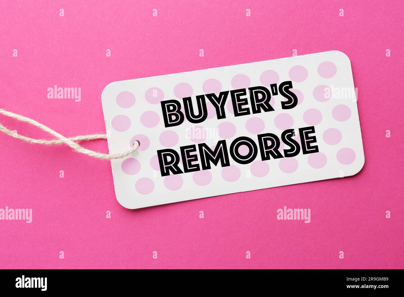 Tag with text Buyer's Remorse on hot background, top view Stock Photo