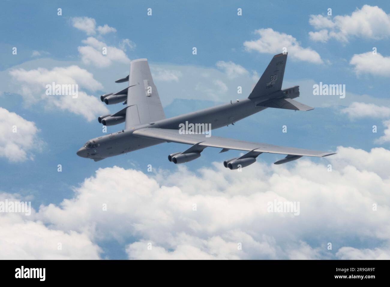 A 307th Bomb Wing B-52 Stratofortress flies through the sky under a 914th Air Refueling Wing KC-135 Stratotanker before fueling, June 26, 2023. The jets also performed touch-and-go landings on the way back to Griffiss International Airport. (U.S. Air Force photo by Senior Airman Celeste Zuniga) Stock Photo