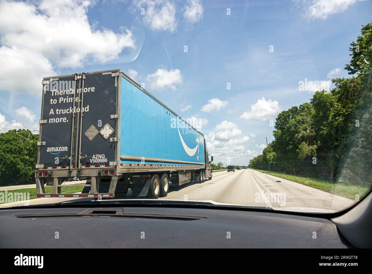 Palm Bay Florida,I-95 Interstate 95 highway,Amazon Prime tractor semi-trailer truck passing,view through car windshield Stock Photo