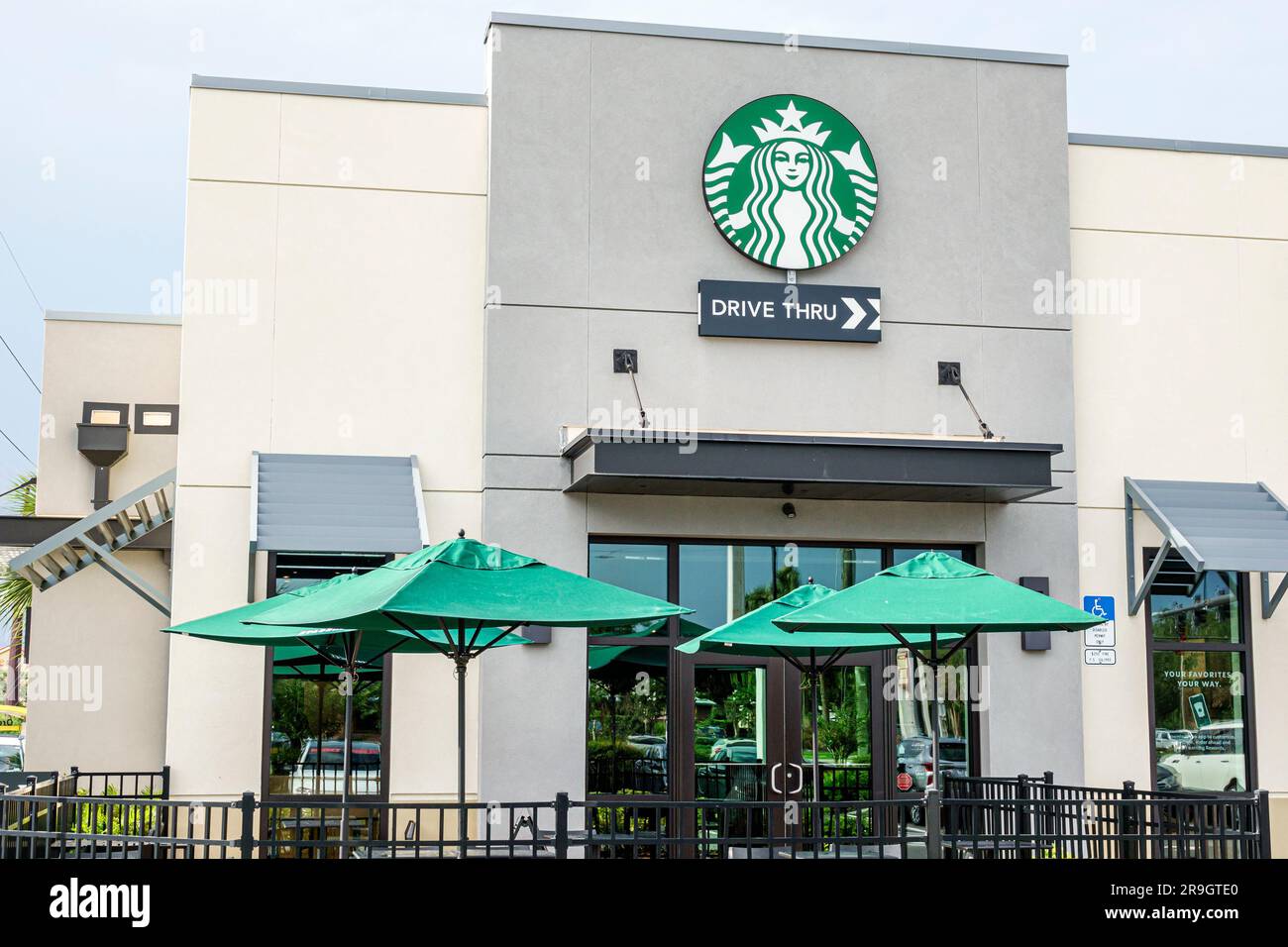 Sanford Florida,Starbucks Coffee logo umbrellas,outside exterior front entrance Stock Photo