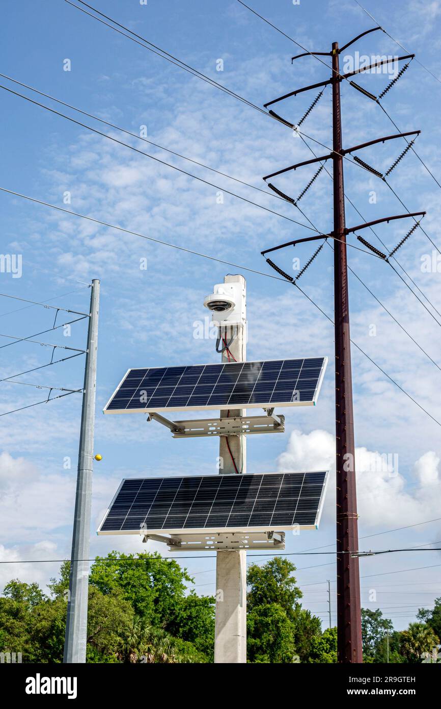 DeBary Florida,utility poles electric grid solar power panels Stock