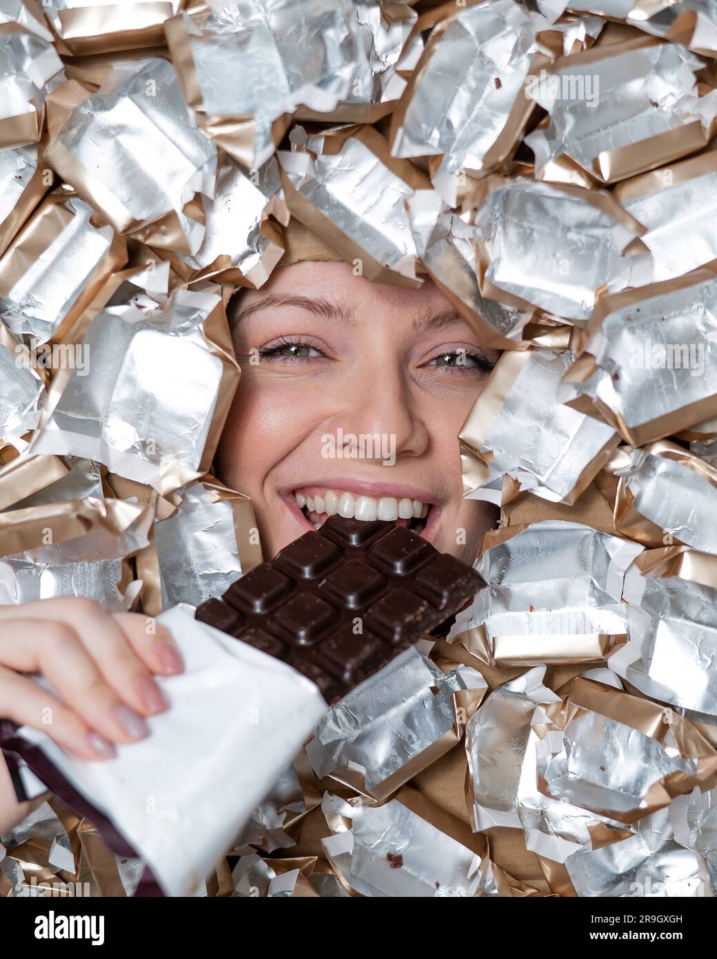 Eating chocolates wrappers hi-res stock photography and images - Alamy