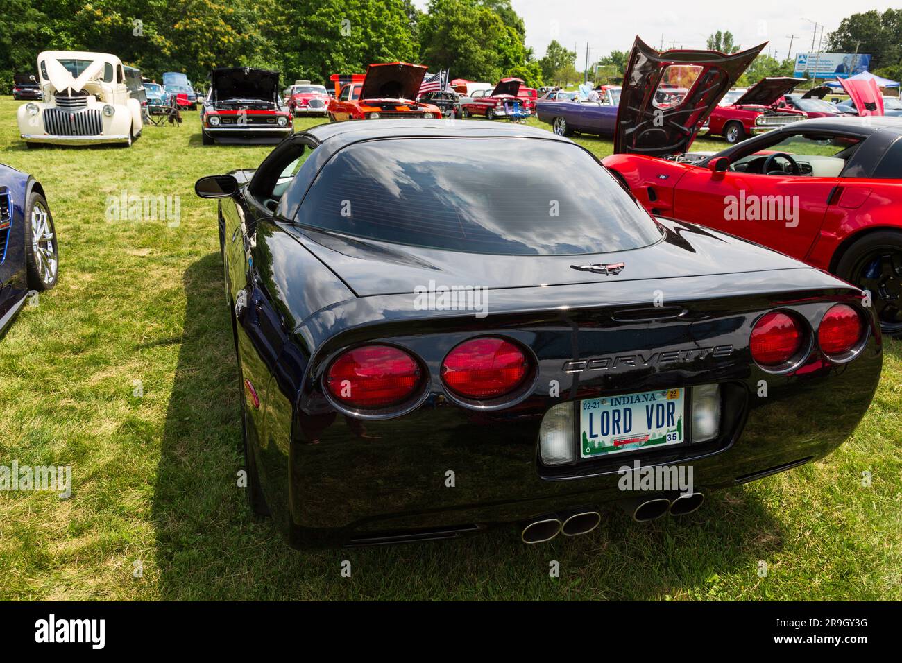 A black C5 Chevrolet Corvette with personalized license plate 'LORD VDR' is on display at a car show in Fort Wayne, Indiana, USA. Stock Photo