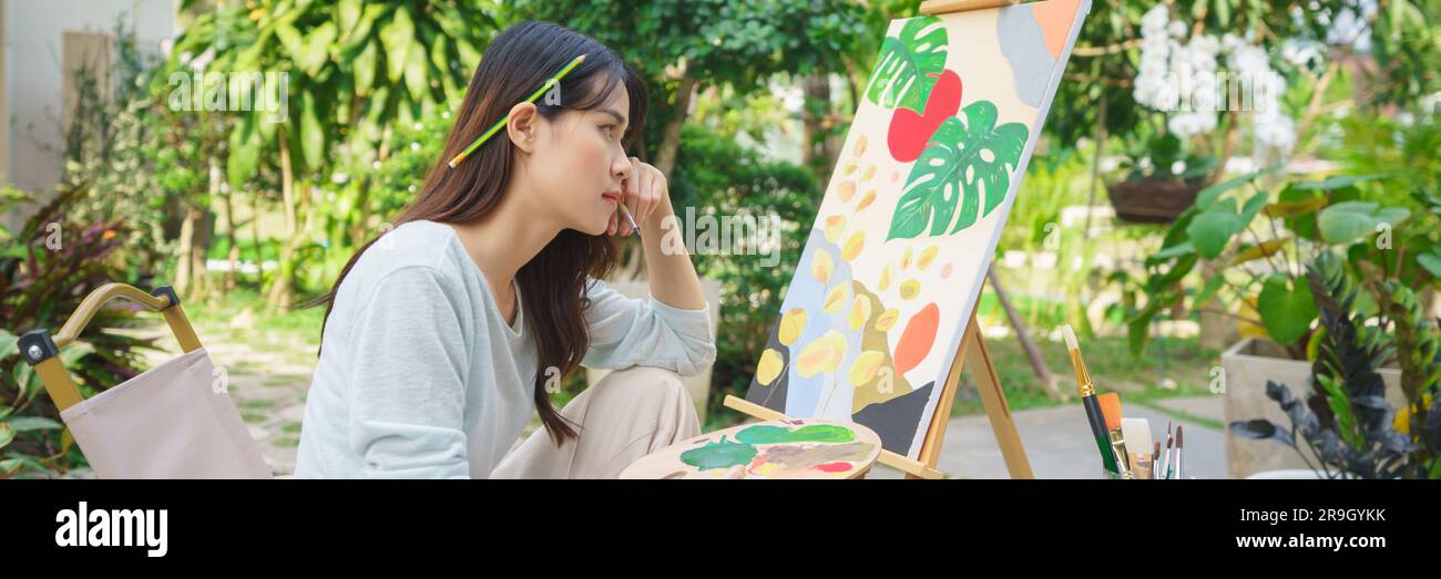 Creative art concept, Female artist thoughtful while looking on ...