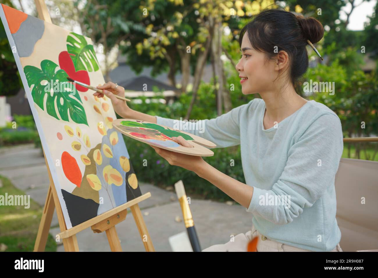 Creative art concept, Female artist holding color palette and brush to ...