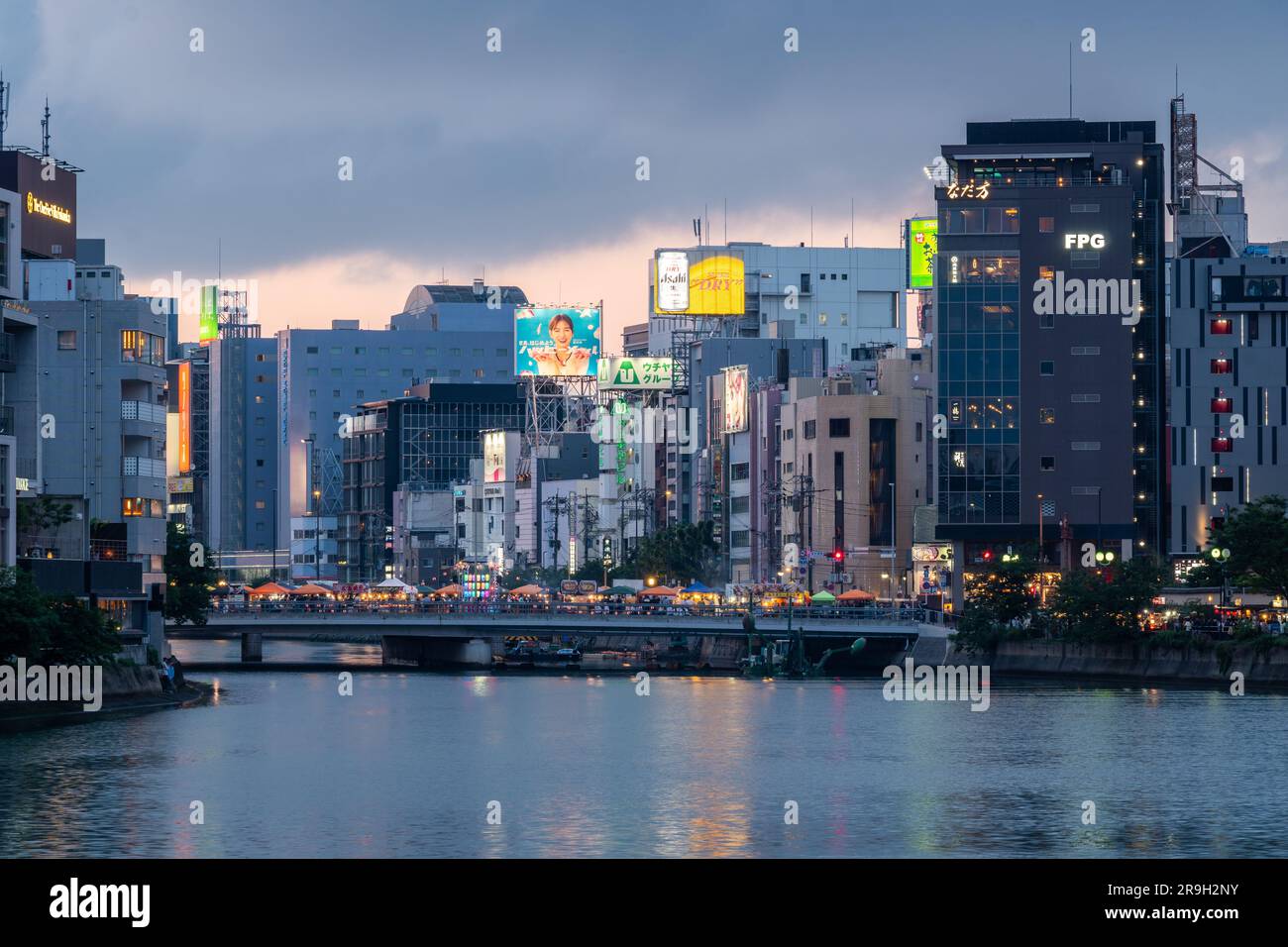 Fukuoka, Japan May 20 2023 The sun sets over the Naka river that flows through the Fukuoka