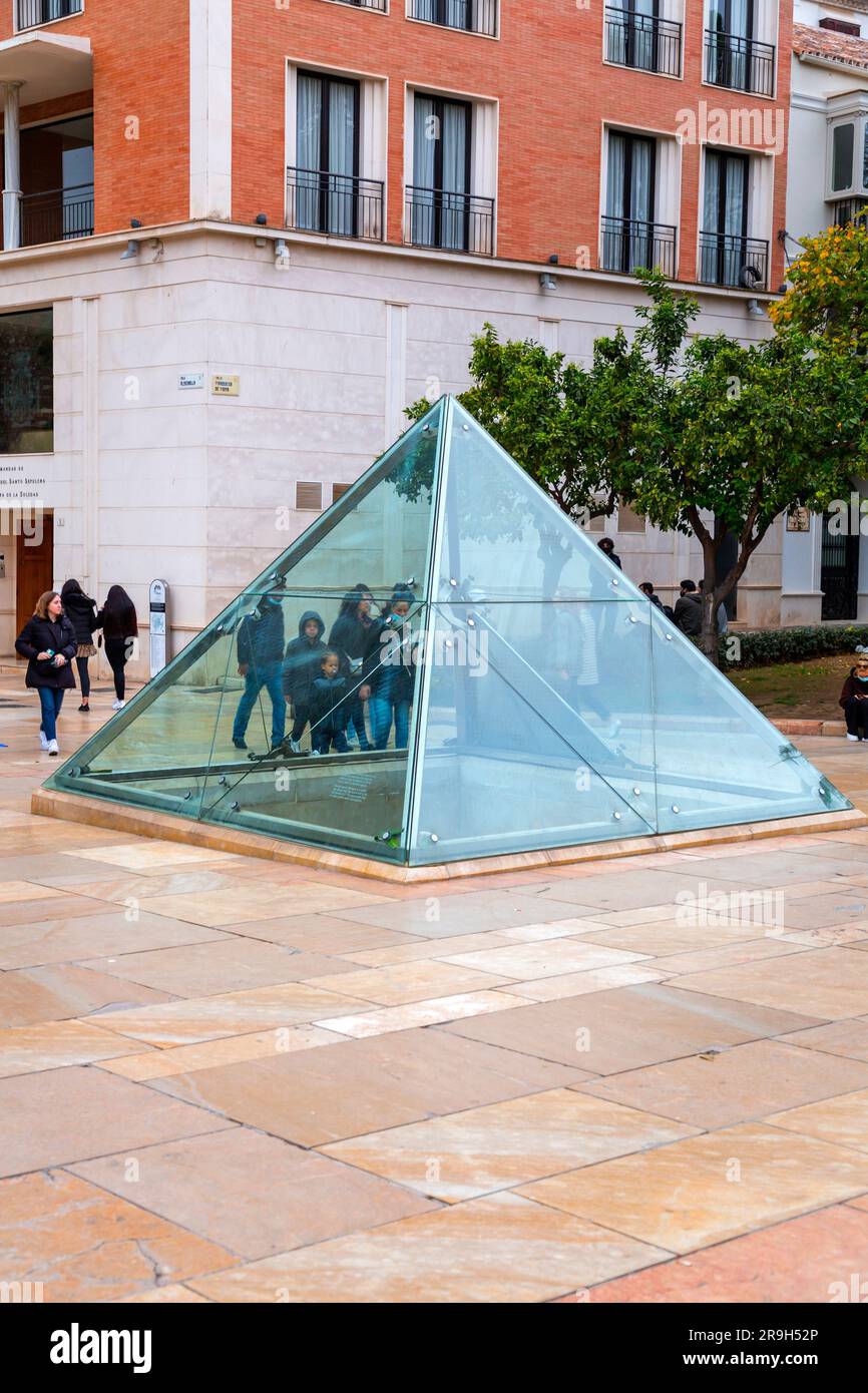 Malaga, Spain - FEB 27, 2022: The Glass Pyramid at the Calle Alcazabilla, a street in the central district of Malaga. Stock Photo