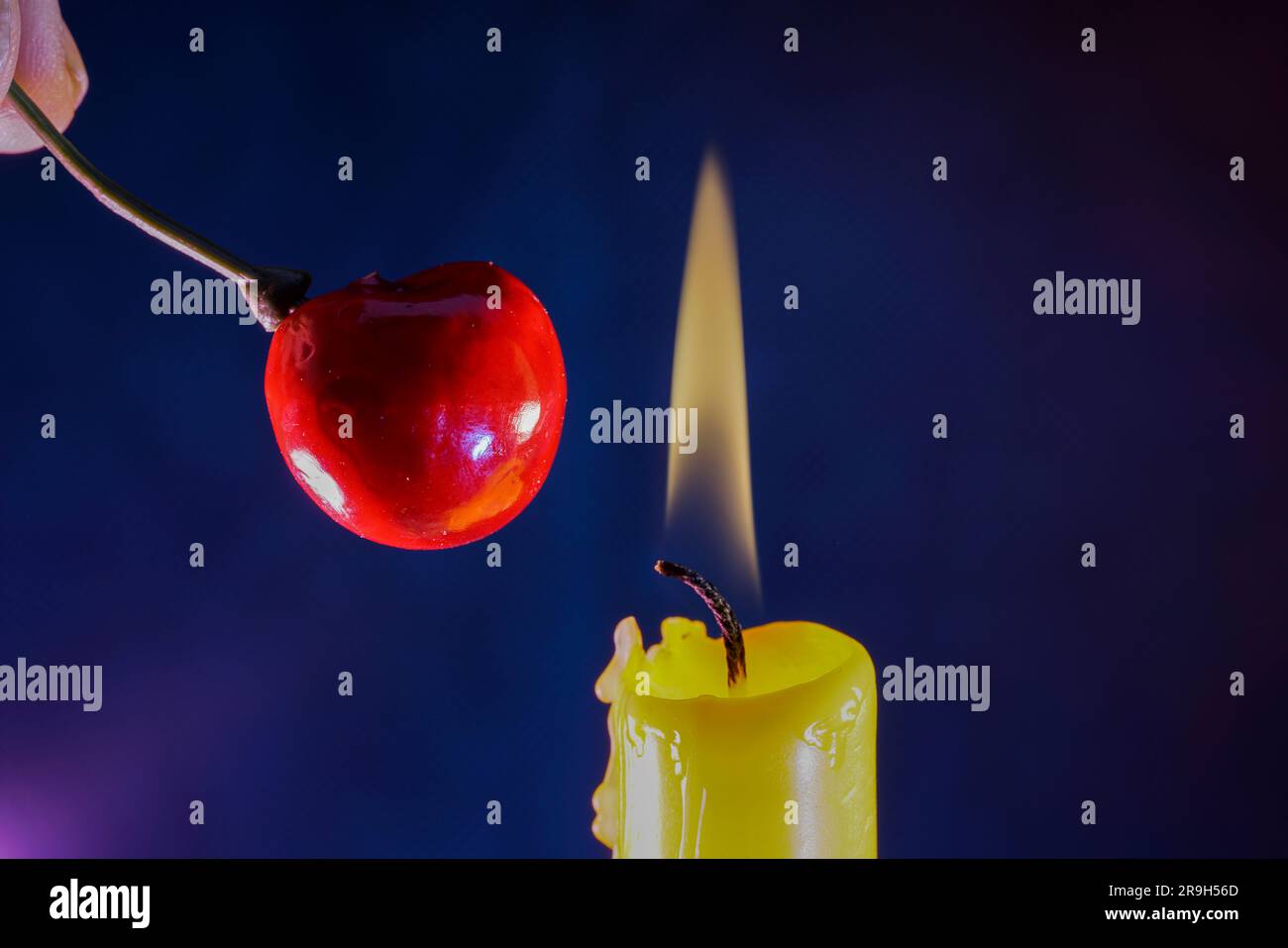 candle with smoke and flame photographed in the studio with color foils