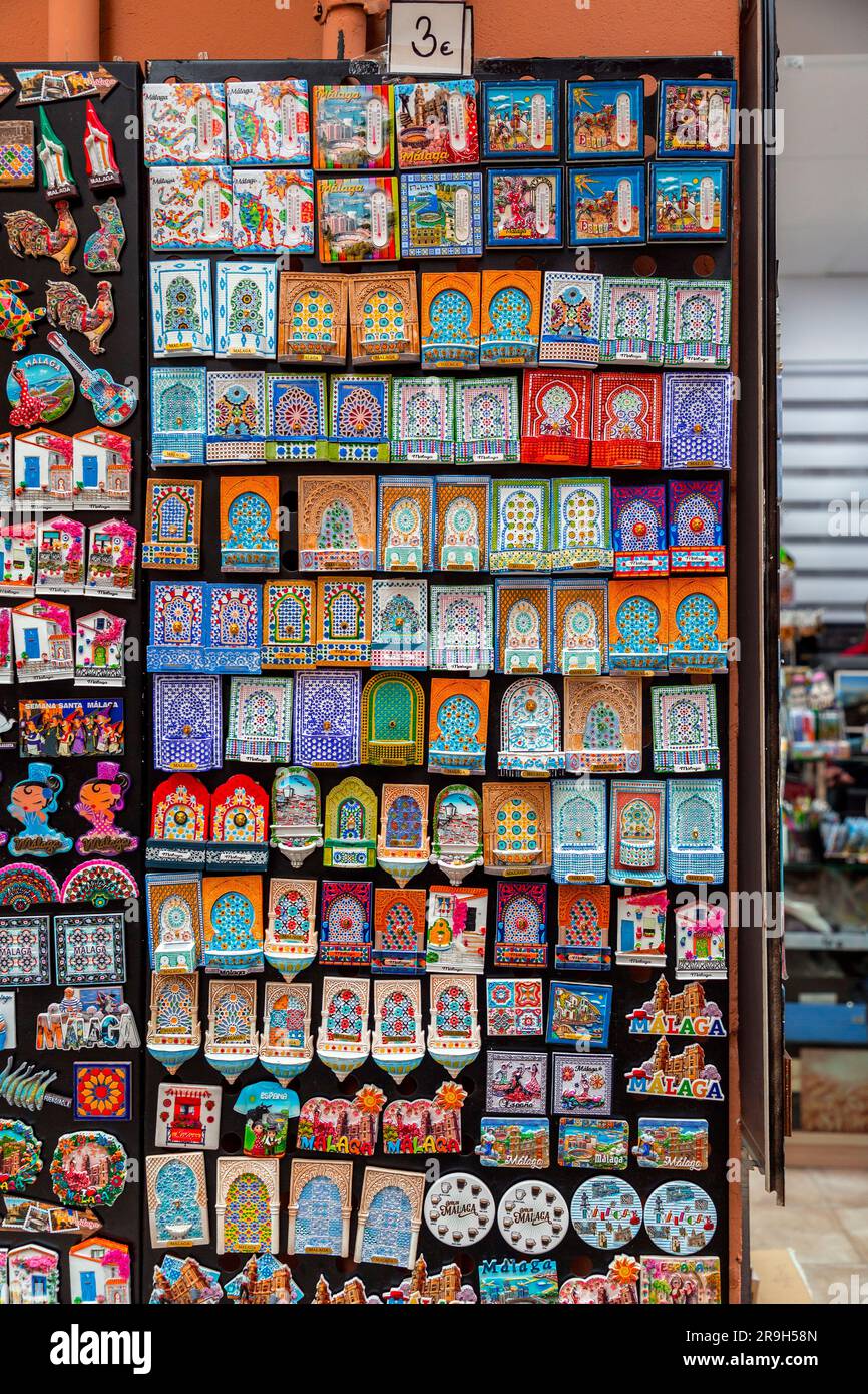 Malaga, Spain- April 03, 2018: Ceramic souvenirs for sale in Malaga, Spain.  Colorful Fridge souvenir magnets Stock Photo - Alamy